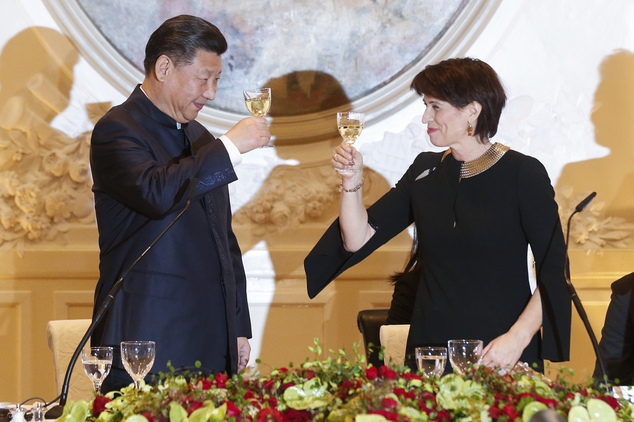 Swiss Federal President, Doris Leuthard, right, and China's President Xi Jinping raise their glasses for a toast at a gala dinner in Bern, Switzerland, Sunday, Jan. 15, 2017. Xi on Sunday kicked off a four-day visit to Switzerland, the first this century by a Chinese leader. It includes planned stops in Geneva, Lausanne and to the World Economic Forum in Davos. (Peter Klaunzer/Pool Photo via AP)