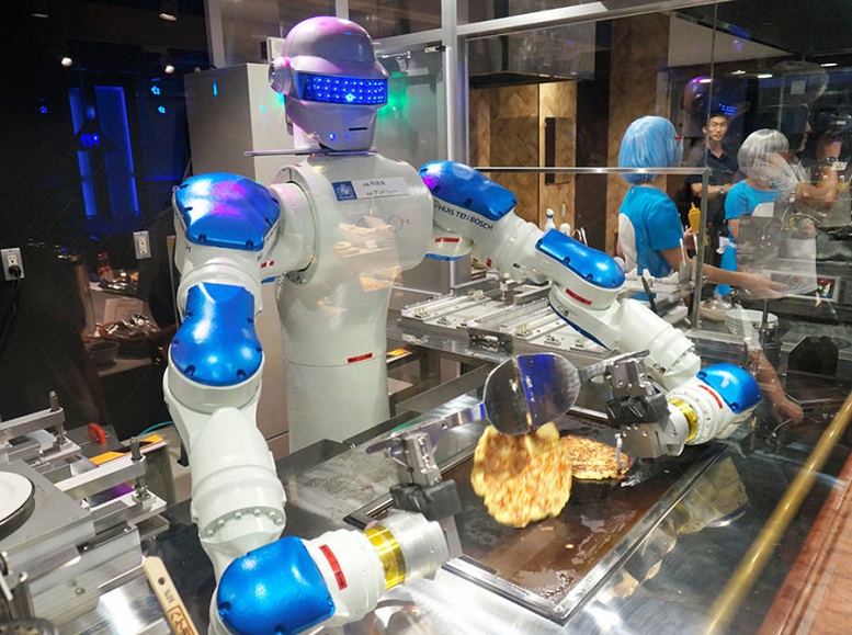 Sebuah Robot Sedang Mengolah Masakan/Foto via express/Nusantaranews