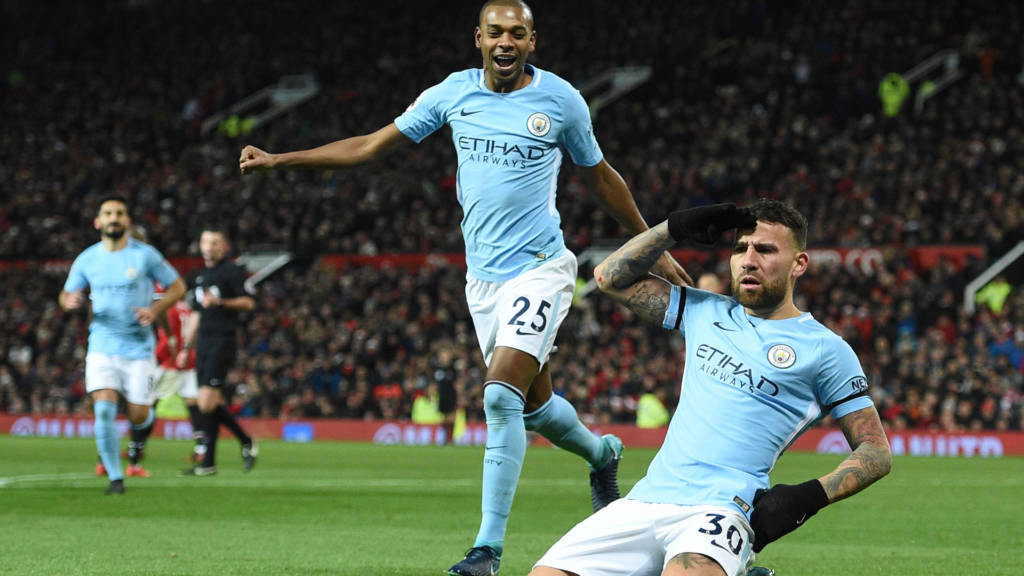 Manchester City Argentinian defender Nicolas Otamendi (R) celebrates scoring their second goal during the English Premier League football match between Manchester United and Manchester City at Old Trafford in Manchester, north west England, on December 10, 2017. / AFP PHOTO / Oli SCARFF / RESTRICTED TO EDITORIAL USE. No use with unauthorized audio, video, data, fixture lists, club/league logos or 'live' services. Online in-match use limited to 75 images, no video emulation. No use in betting, games or single club/league/player publications. / (Photo credit should read OLI SCARFF/AFP/Getty Images)