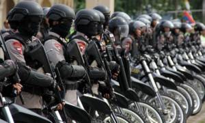 Pemerintah dan Polisi Dinilai Belum Rela Kasus Papua Ditangani TNI