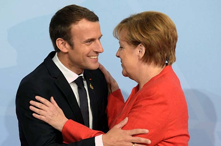 Kenselir Jerman Angela Merkel dan Presiden Prancis Emmanuel Macron/Foto: financial review