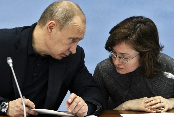 Vladimir Putin dan Gubernur Bank Sentral Rusia, Elvira Naubilina. (FOTO: Business Insider)